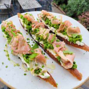 English Pea Crostini with Ricotta, Mint, and Prosciutto